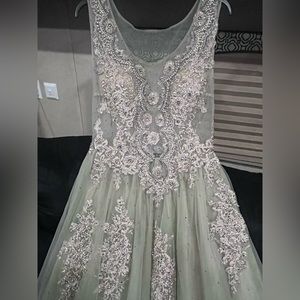 greenish color with gold appliqués grey stones and pearls beautiful dress